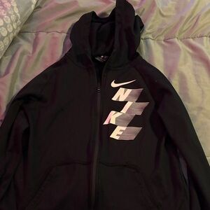 Boys Nike jacket with white Nike written on it in size XL